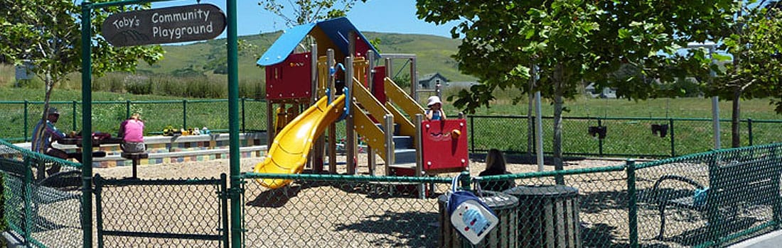 Colorful playground with kids playing.
