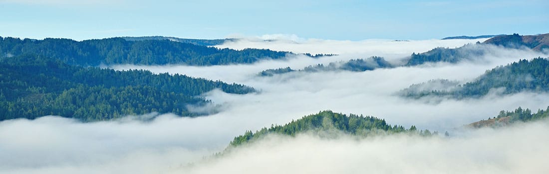 Clouds floating across the peaks of Loma Alta