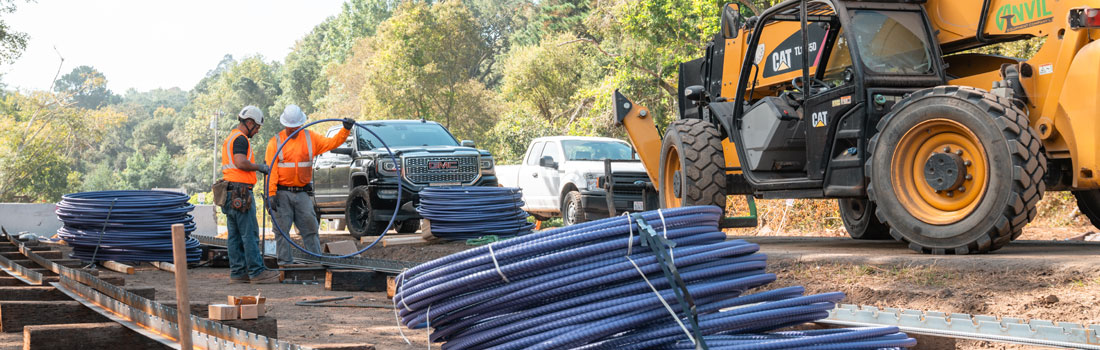 Construction workers and heavy equipment at Bolinas Wye project